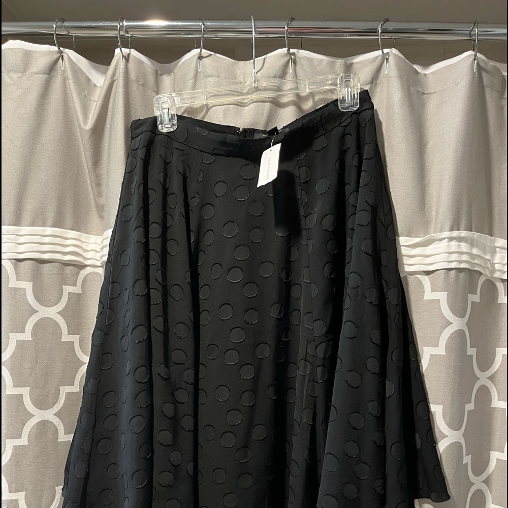 Great little go anywhere skirt.  Length is 24” from waistband